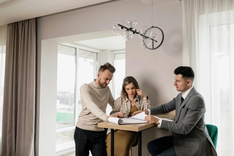 Homeowner couple reviewing plans with a licensed general contractor in Gainesville FL